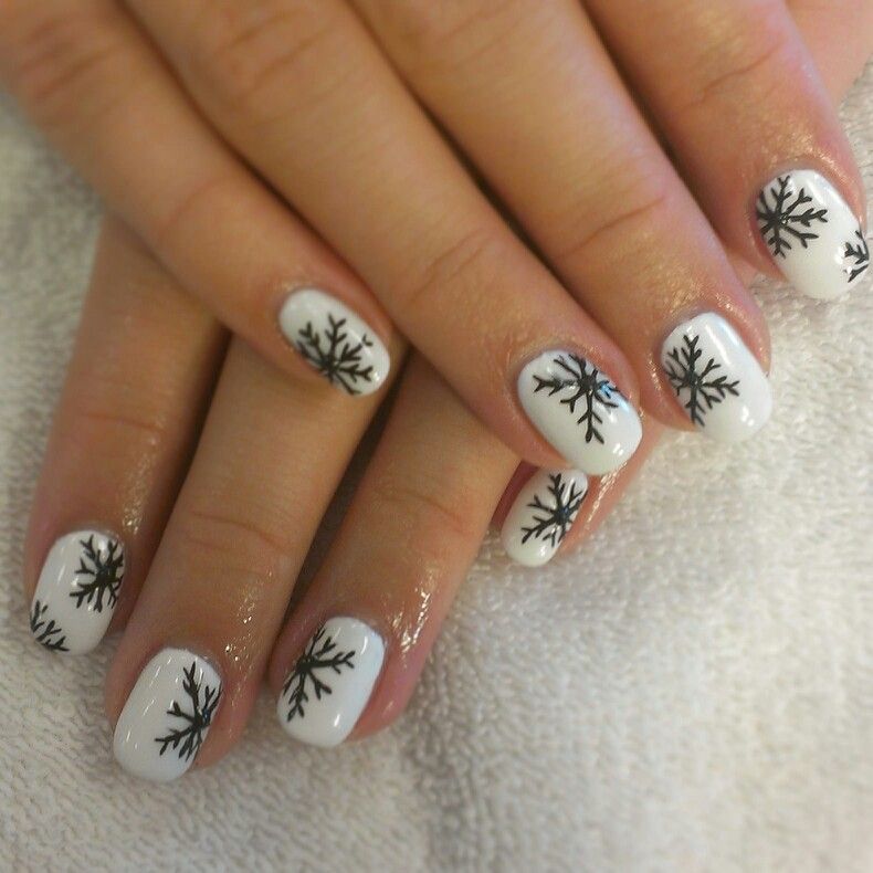 Icy White Nails with Black Snow Accents