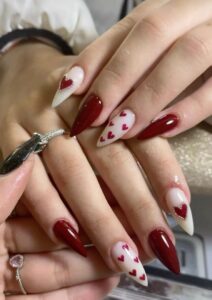 Deep Crimson Almond Nails With Floating Hearts